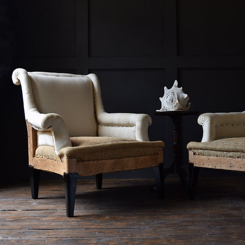 Pair of French Ebonised Scroll Back armchairs. Upholstery Inclusive.