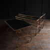 Nest of French Mid-Century Gilded Iron Mirrored Top Tables.