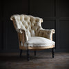 19th Century French "Chapeau de Gendarme" Buttoned Armchair.  Upholstery inclusive.