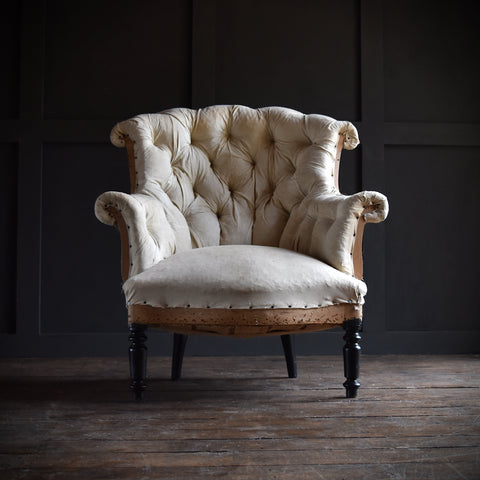 19th Century French "Chapeau de Gendarme" Buttoned Armchair.  Upholstery inclusive.