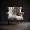 19th Century French "Chapeau de Gendarme" Buttoned Armchair.  Upholstery inclusive.