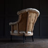 19th Century French "Chapeau de Gendarme" Buttoned Armchair.  Upholstery inclusive.