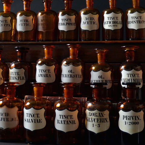 A Collection of Nineteen Amber Apothecary Bottles, Circa 1900.