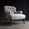 Howard & Sons London Button back Armchair, Circa 1880. Upholstery inclusive.