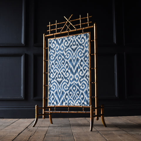 French Giltwood Faux Bamboo Fire Screen with Ikat panel. Circa 1900-1920